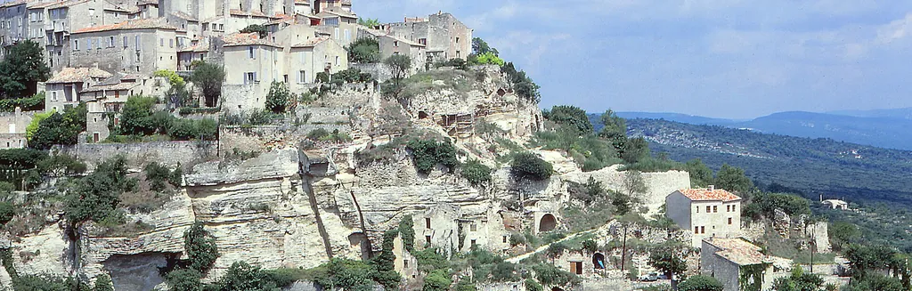 The hilltop village of Gordes perched on its rocky spur in the sun, one of the most beautiful photo spots in the Luberon, Provence